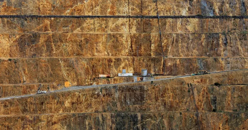 a very long road going through a huge mountain